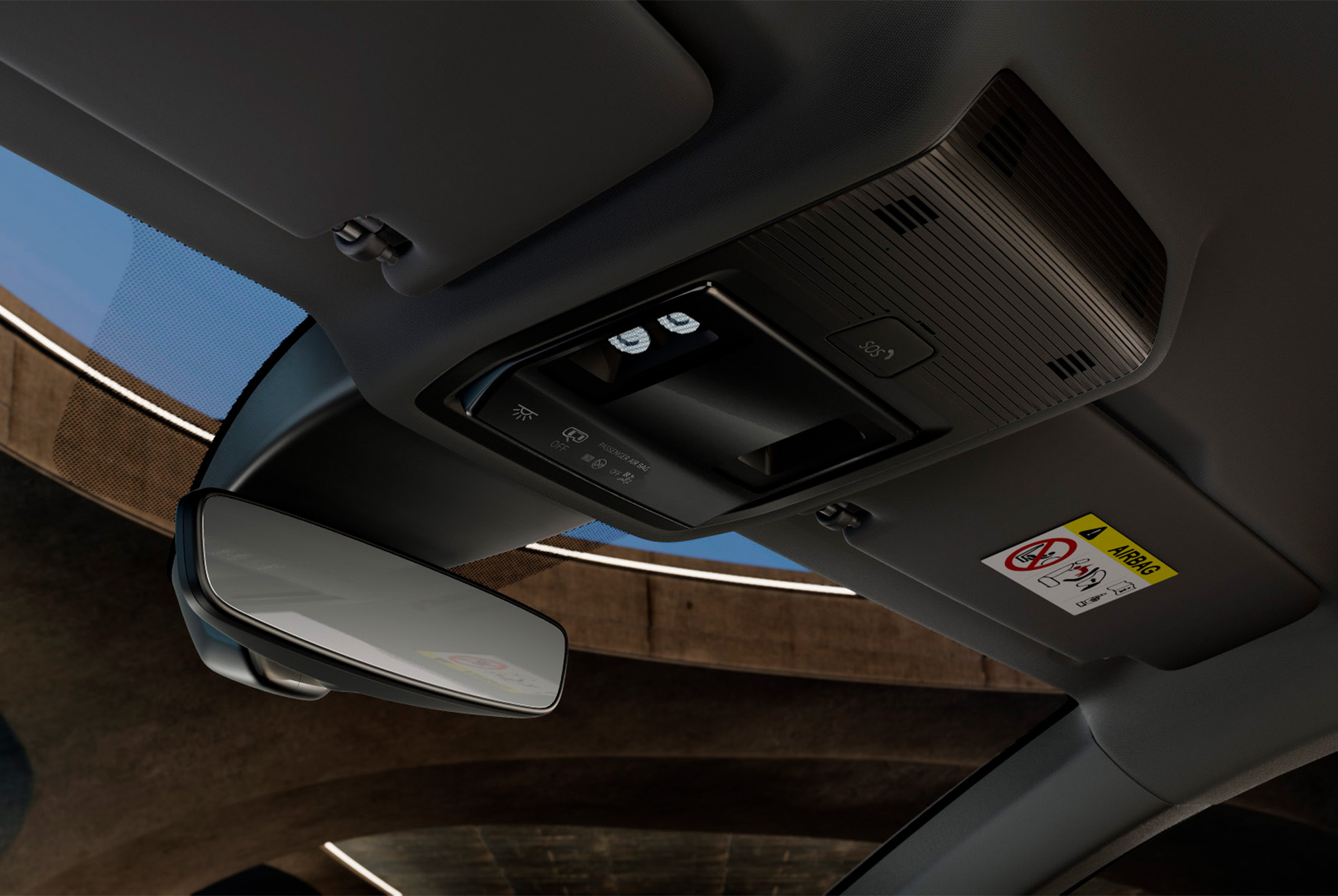 Vista interior del nuevo CUPRA León Sportstourer 2024, donde se ve la consola superior con espejo retrovisor, luces LED del habitáculo, diversos mandos y funciones de conectividad CUPRA, incluido un botón de emergencia SOS.